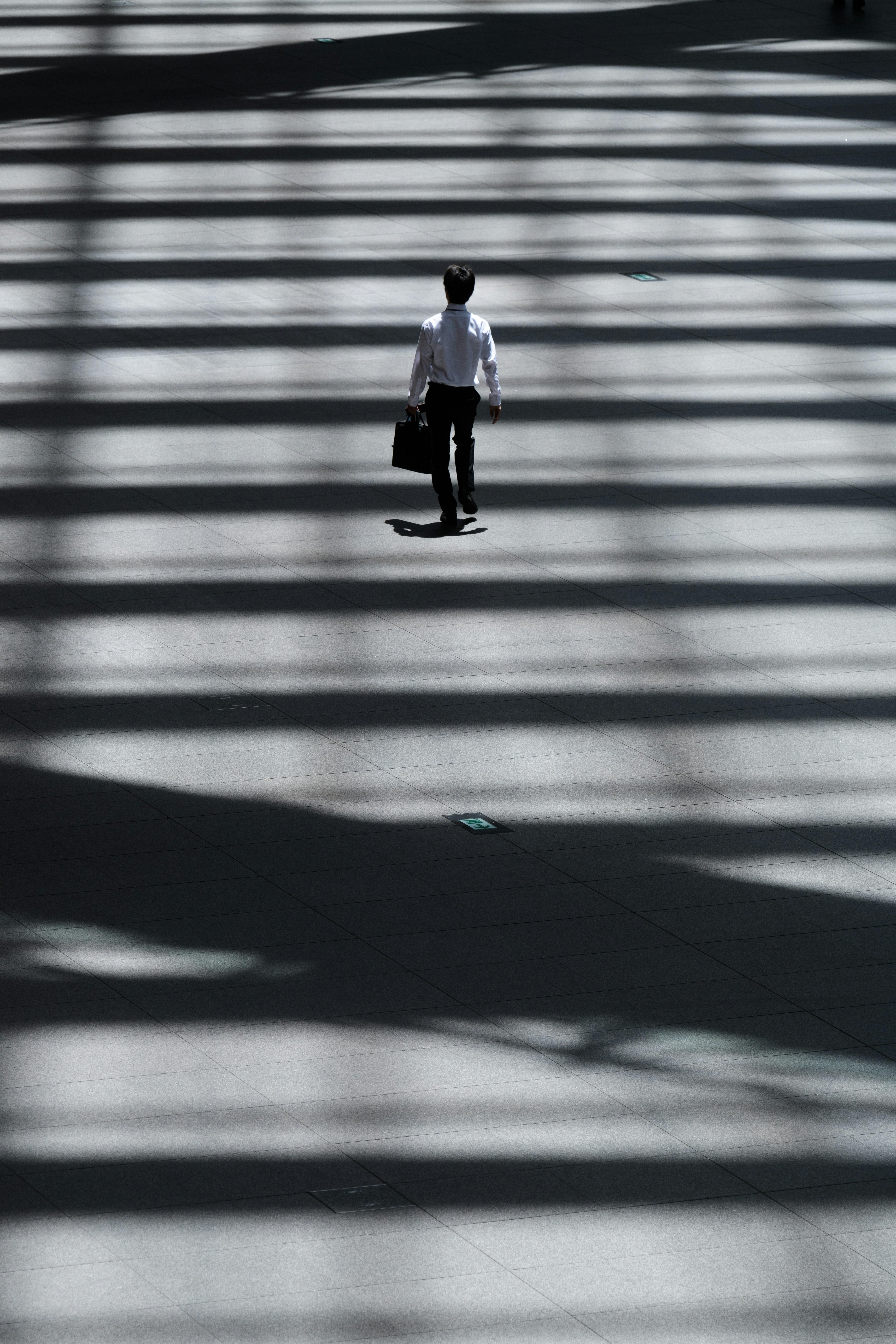 a man walking in the sun
